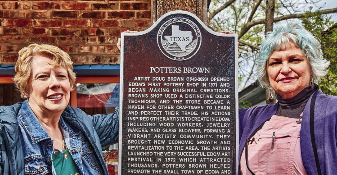 Cynthia Forsyth and Beth Brown are shown with the Texas historical marker at Potters Brown in Edom. The historical marker was officially dedicated during a ceremony March 9. The business was opened by Doug Brown, Beth Brown’s late husband, in 1971. Photo courtesy of Craig D. Blackmon, FAIA, Edom