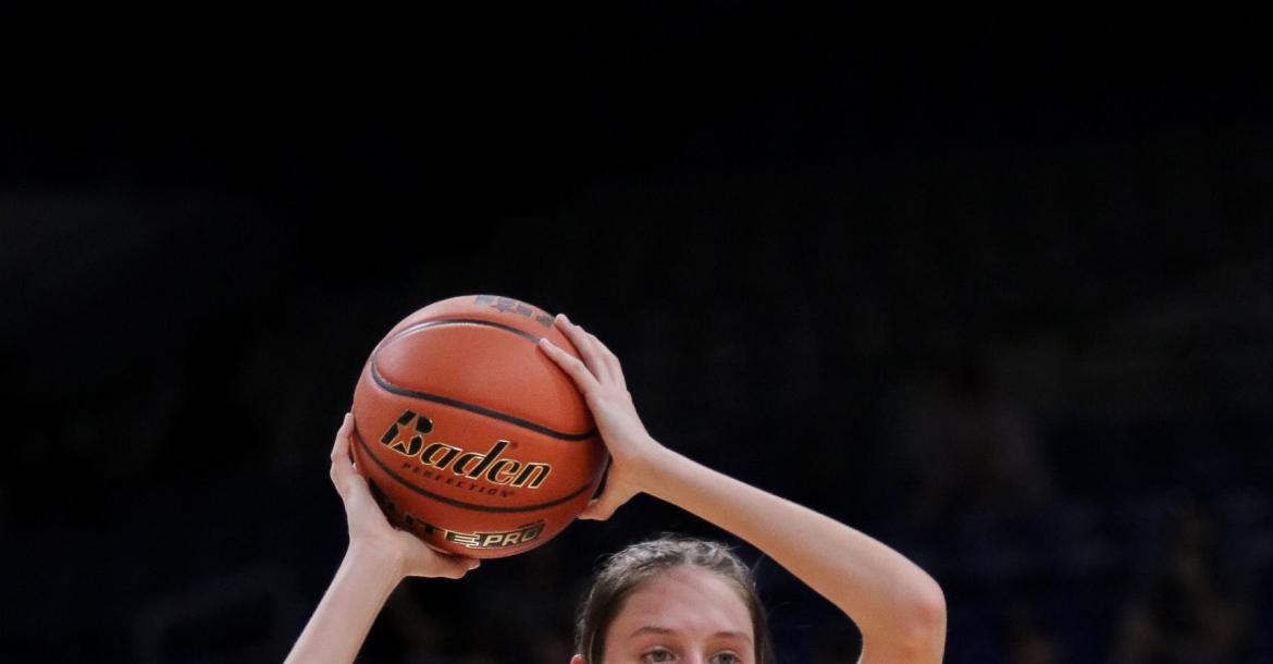 McKenna Wise (33) of the Martins Mill Lady Mustangs looks for a teammate to pass the ball to during the Class 2A State Championship Game March 2 against Nocona. The Lady Mustangs edged Nocona, 44-42, on a last second shot to claim the state championship at The Alamodome in San Antonio.